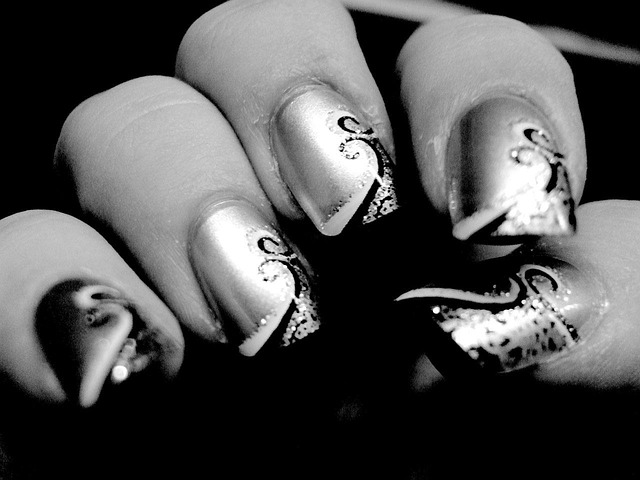 Black and white decorated nails with metallic shine